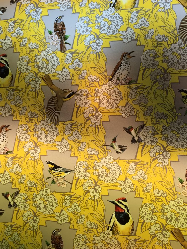 Window film inspired by BirdSafe Pittsburgh and designed by a local artist Ashley Cecil window art with a yellow background and bird images